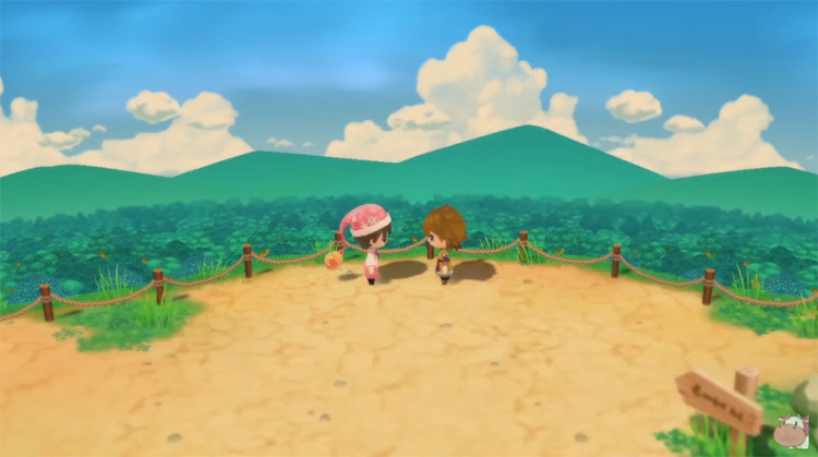 Cliff stands with the farmer at the summit.