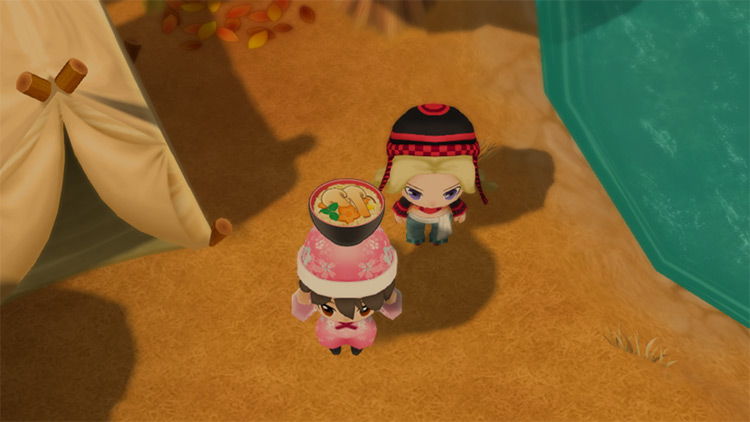 The farmer stands next to Jennifer while holding a bowl of Matsutake Rice.